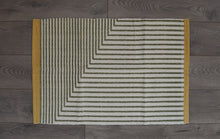 Green, yellow & White under mat