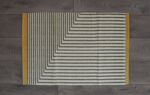 Green, yellow & White under mat