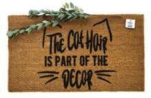 The cat hair is part of the decor doormat